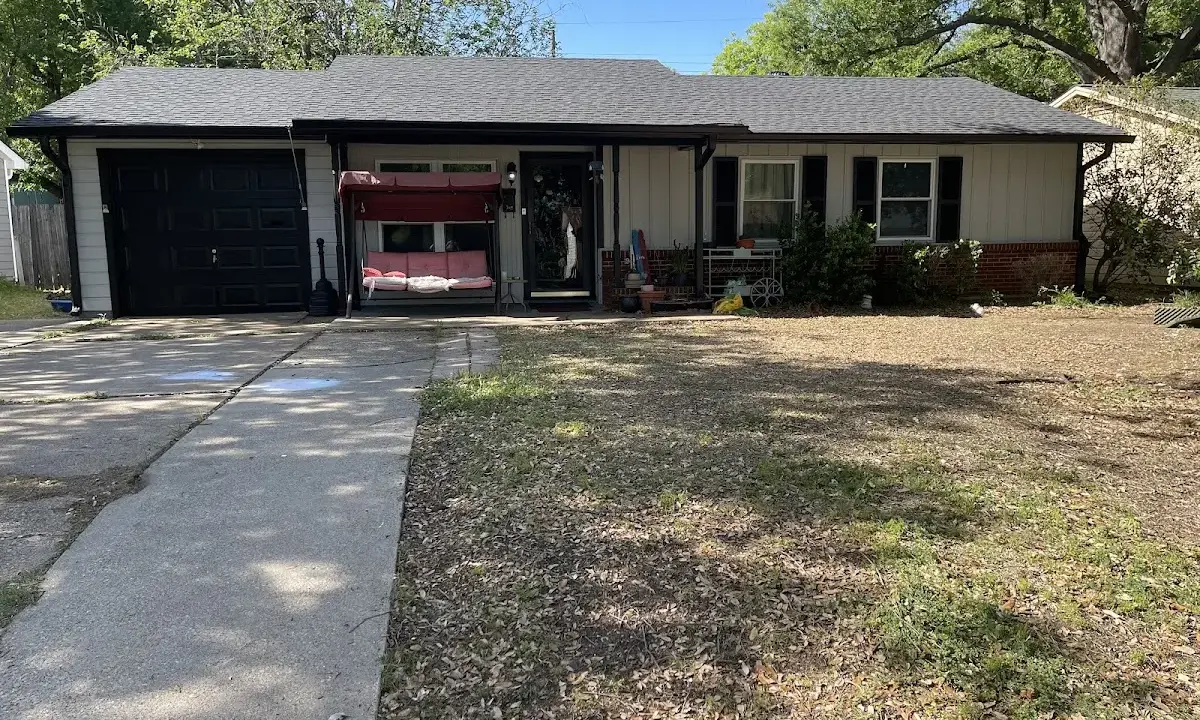 Wind Damage Roof Repair crew at work on a residential roof in Fort Stewart
